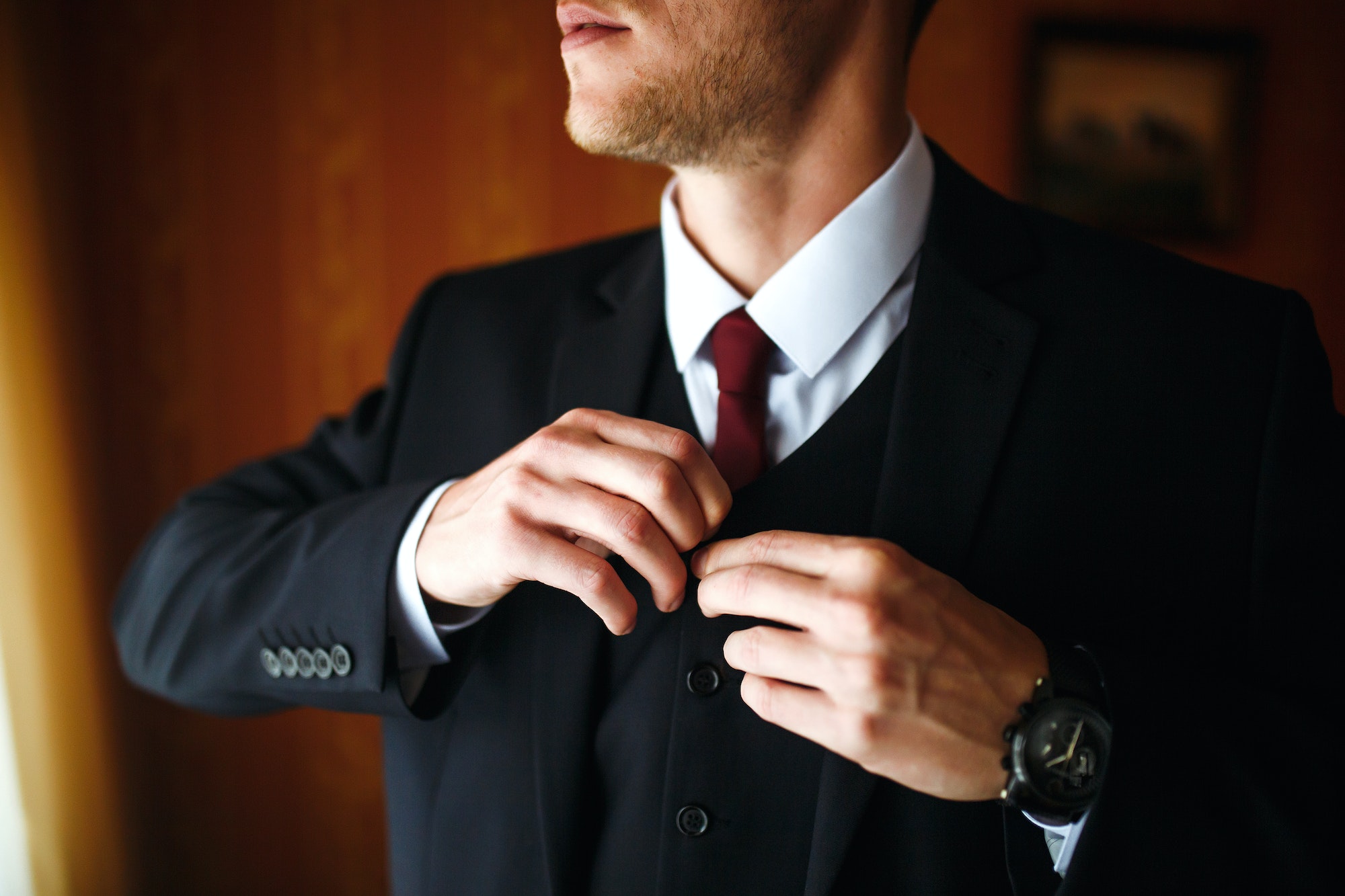 Luxury groom in suit. Businessman. Morning Groom Fees. The beginning of wedding day. Men's fashion.